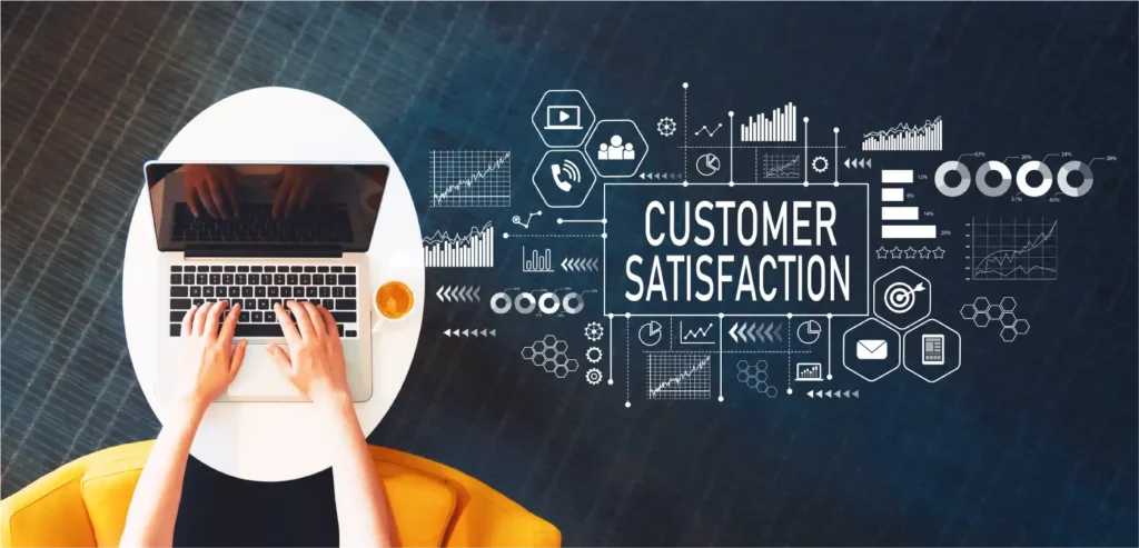 Person on a laptop with the highlighted words "customer satisfaction," indicating the benefits of a smooth checkout process with the right credit card processing company.